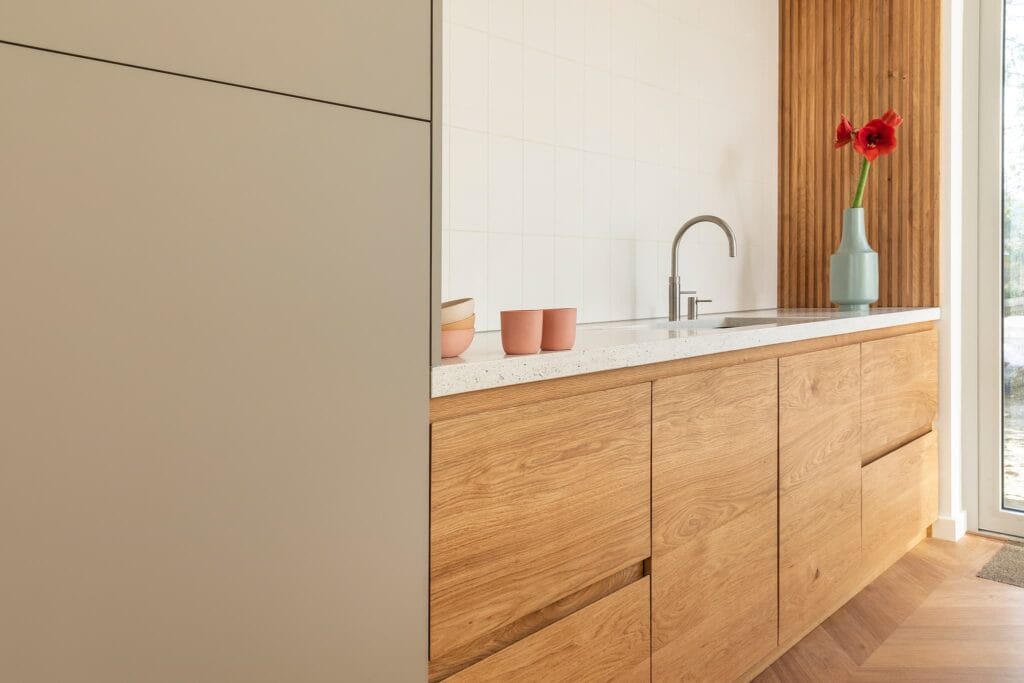 Houten keuken met Arpa Fenix – gemaakt door meubelmaker Eindhoven Moderne Design keuken op maat · The Portland · Houtwerff Eindhoven